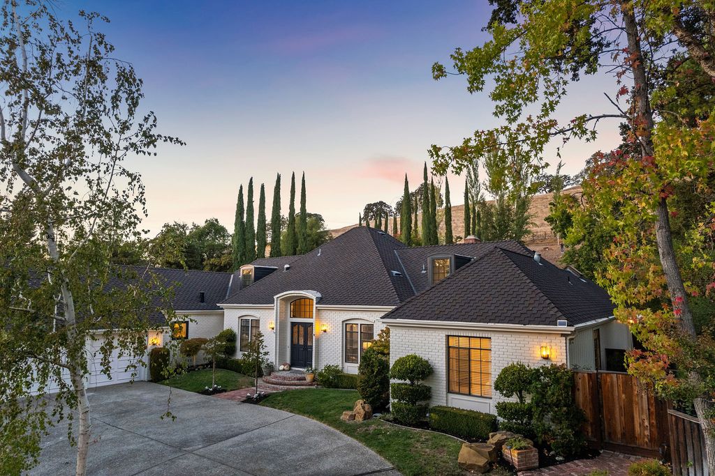 1941 Parkmont Drive, Alamo, California is beautiful remodeled custom home features a resort-like backyard with pool, spa, outdoor kitchen, built-in fire pit, bocce court, expansive level grassy area to play, sport court location, producing vineyard, vegetable garden beds, & fruit trees.