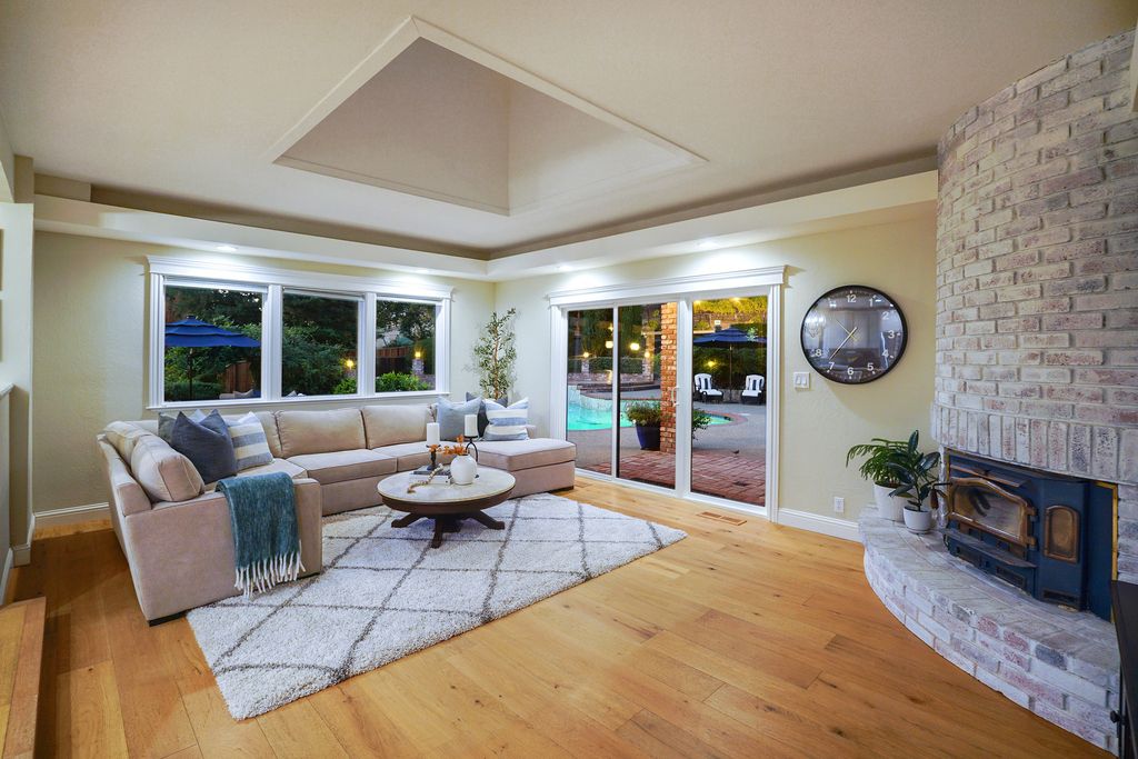 1941 Parkmont Drive, Alamo, California is beautiful remodeled custom home features a resort-like backyard with pool, spa, outdoor kitchen, built-in fire pit, bocce court, expansive level grassy area to play, sport court location, producing vineyard, vegetable garden beds, & fruit trees.