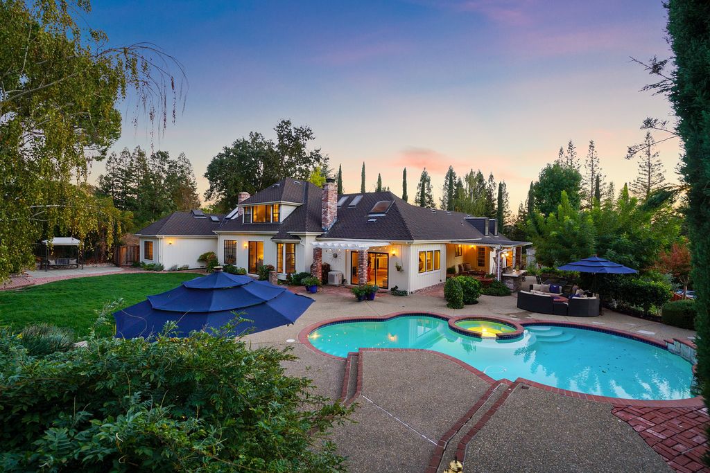 1941 Parkmont Drive, Alamo, California is beautiful remodeled custom home features a resort-like backyard with pool, spa, outdoor kitchen, built-in fire pit, bocce court, expansive level grassy area to play, sport court location, producing vineyard, vegetable garden beds, & fruit trees.