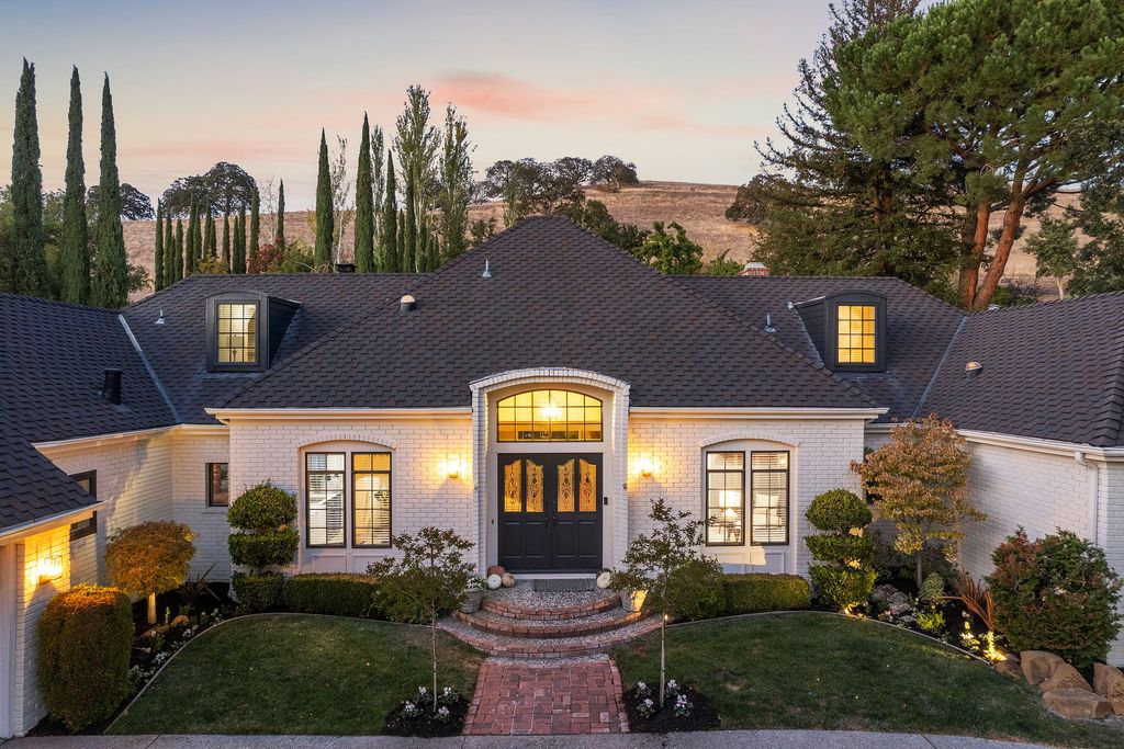 1941 Parkmont Drive, Alamo, California is beautiful remodeled custom home features a resort-like backyard with pool, spa, outdoor kitchen, built-in fire pit, bocce court, expansive level grassy area to play, sport court location, producing vineyard, vegetable garden beds, & fruit trees.