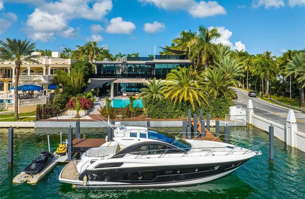 158 Palm Avenue, Miami Beach, Florida is a new construction masterpiece in one of the most coveted Miami Beach gated communities with 100' water frontage, stunning bay and skyline views.