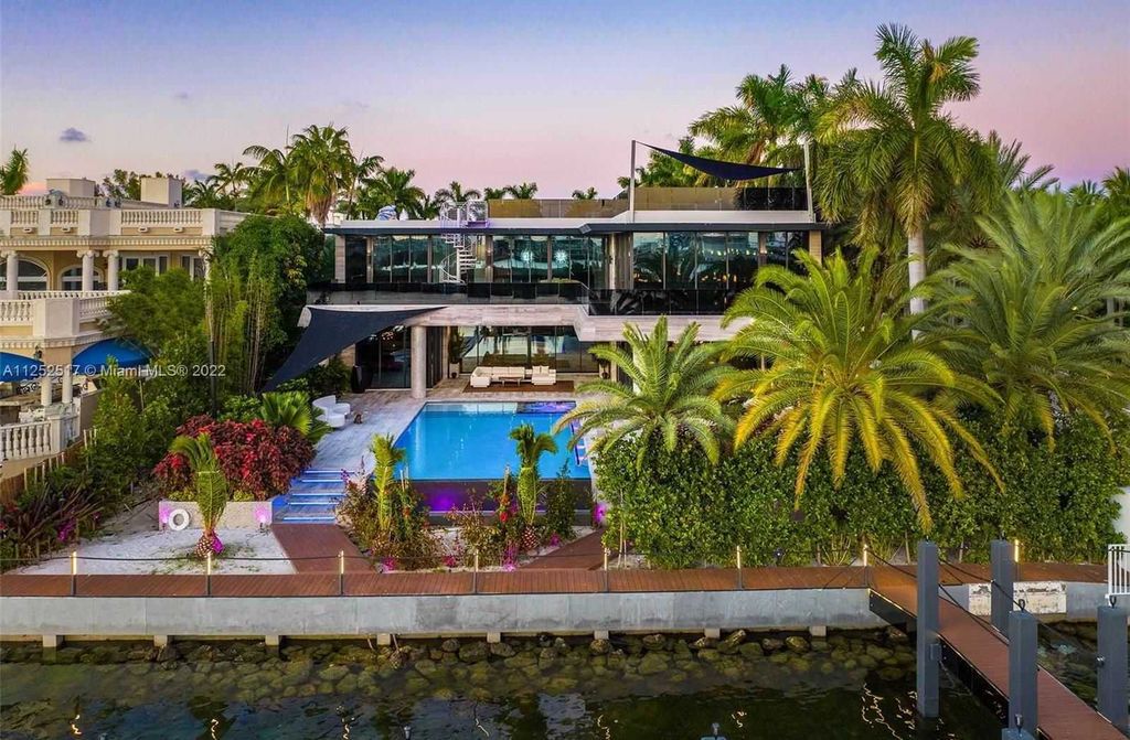 158 Palm Avenue, Miami Beach, Florida is a new construction masterpiece in one of the most coveted Miami Beach gated communities with 100' water frontage, stunning bay and skyline views.