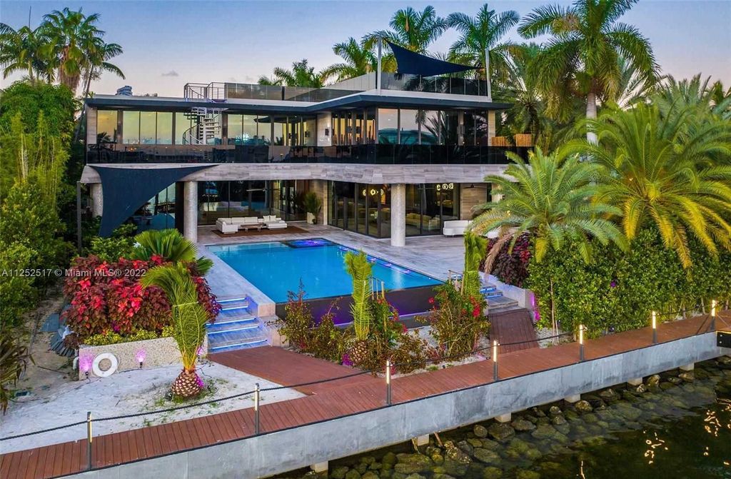 158 Palm Avenue, Miami Beach, Florida is a new construction masterpiece in one of the most coveted Miami Beach gated communities with 100' water frontage, stunning bay and skyline views.