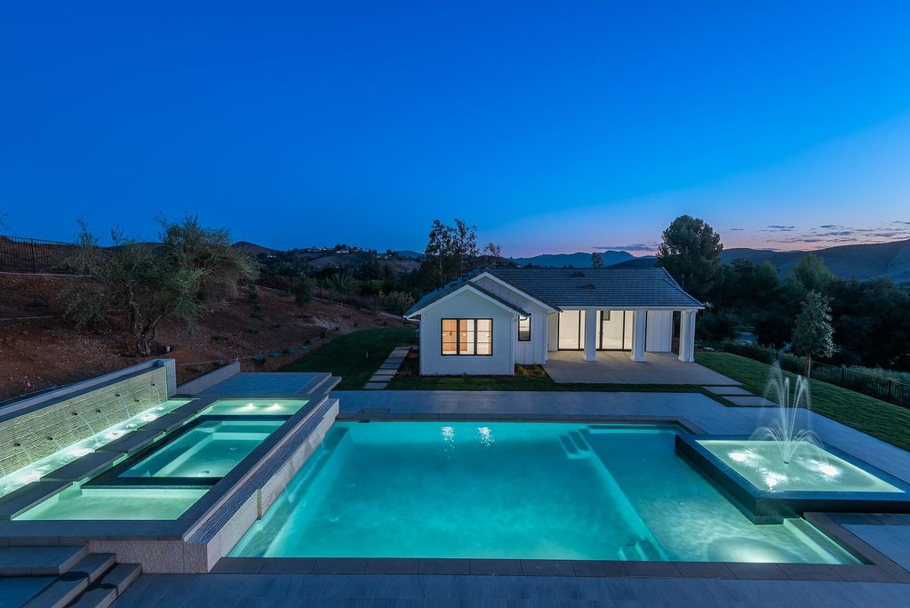 The Home in Thousand Oaks, a special property in the ultra exclusive gated community with extraordinary quality finishes, sensational views and beautiful grounds boasting a custom pool, spa, multiple fountains and lush professional landscape is now available for sale. This home located at 1690 Miller Ranch Dr, Thousand Oaks, California