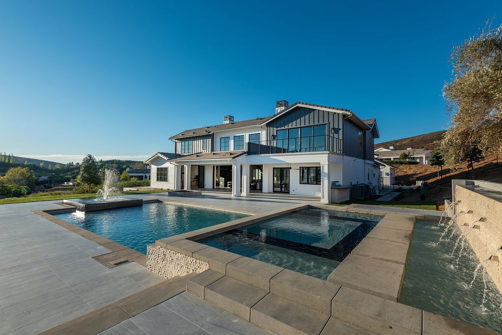 The Home in Thousand Oaks, a special property in the ultra exclusive gated community with extraordinary quality finishes, sensational views and beautiful grounds boasting a custom pool, spa, multiple fountains and lush professional landscape is now available for sale. This home located at 1690 Miller Ranch Dr, Thousand Oaks, California