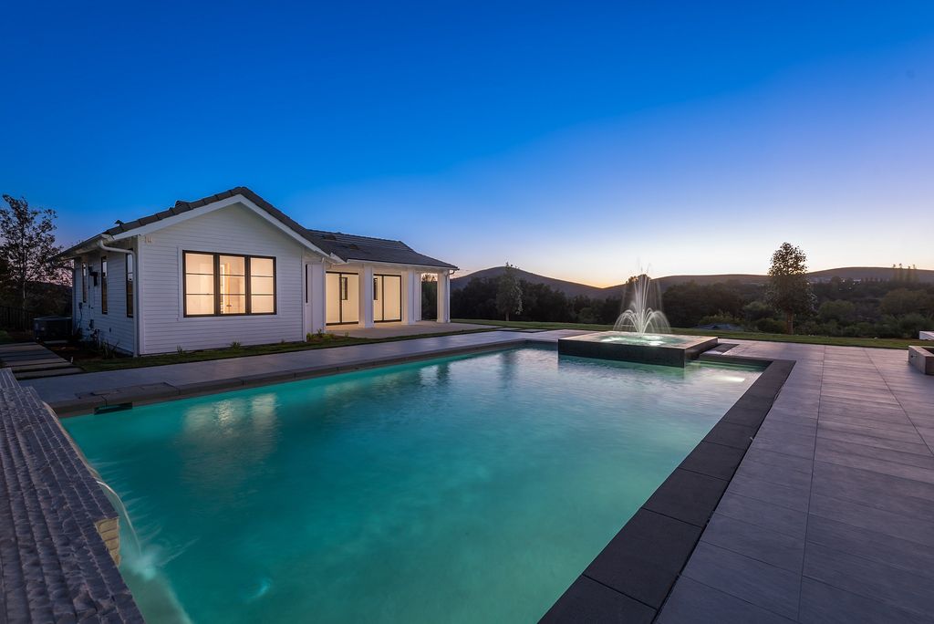 The Home in Thousand Oaks, a special property in the ultra exclusive gated community with extraordinary quality finishes, sensational views and beautiful grounds boasting a custom pool, spa, multiple fountains and lush professional landscape is now available for sale. This home located at 1690 Miller Ranch Dr, Thousand Oaks, California