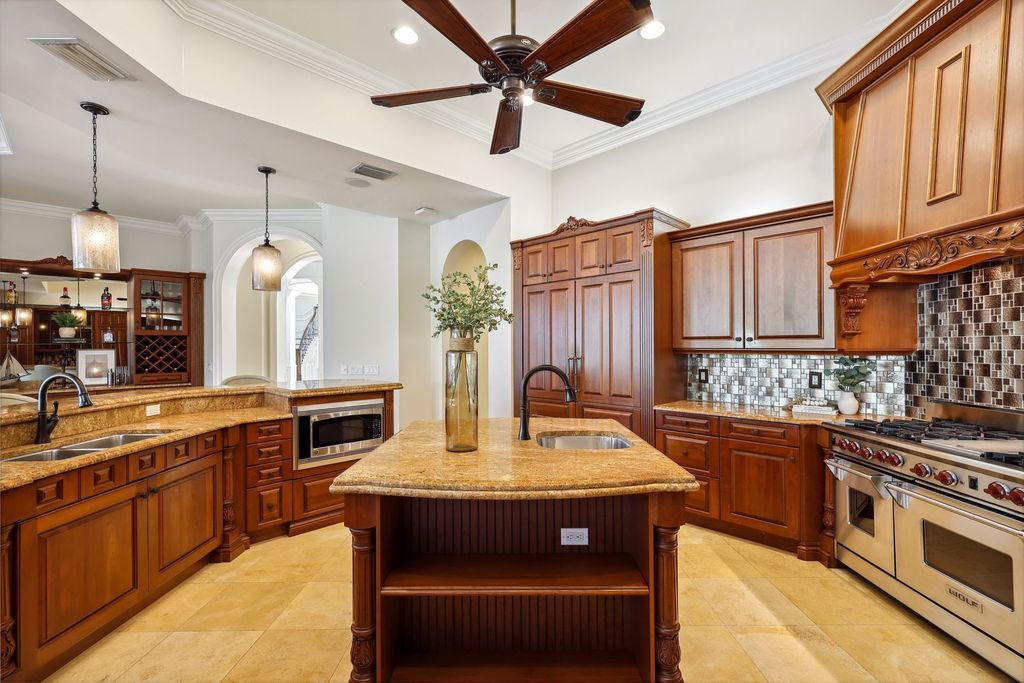 2539 Escada Court, Naples, Florida is a custom-built estate just minutes to world class beaches, shopping and fine dining with picturesque pool and lake views from just about every room.