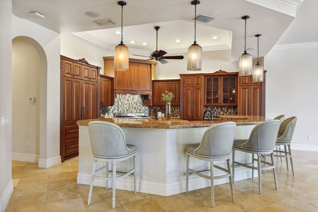 2539 Escada Court, Naples, Florida is a custom-built estate just minutes to world class beaches, shopping and fine dining with picturesque pool and lake views from just about every room.