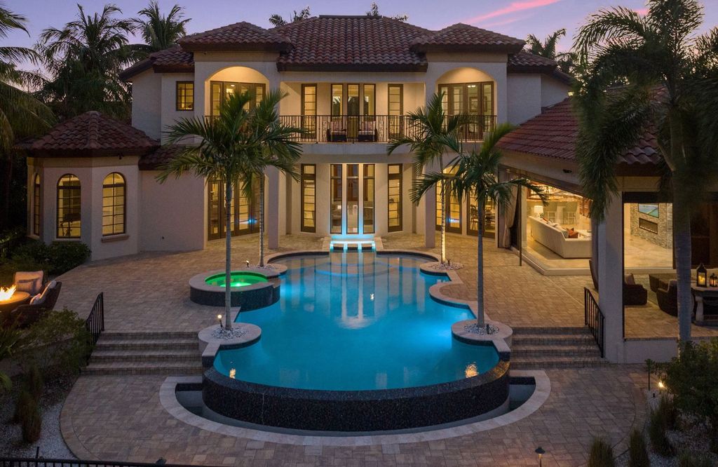 2539 Escada Court, Naples, Florida is a custom-built estate just minutes to world class beaches, shopping and fine dining with picturesque pool and lake views from just about every room.
