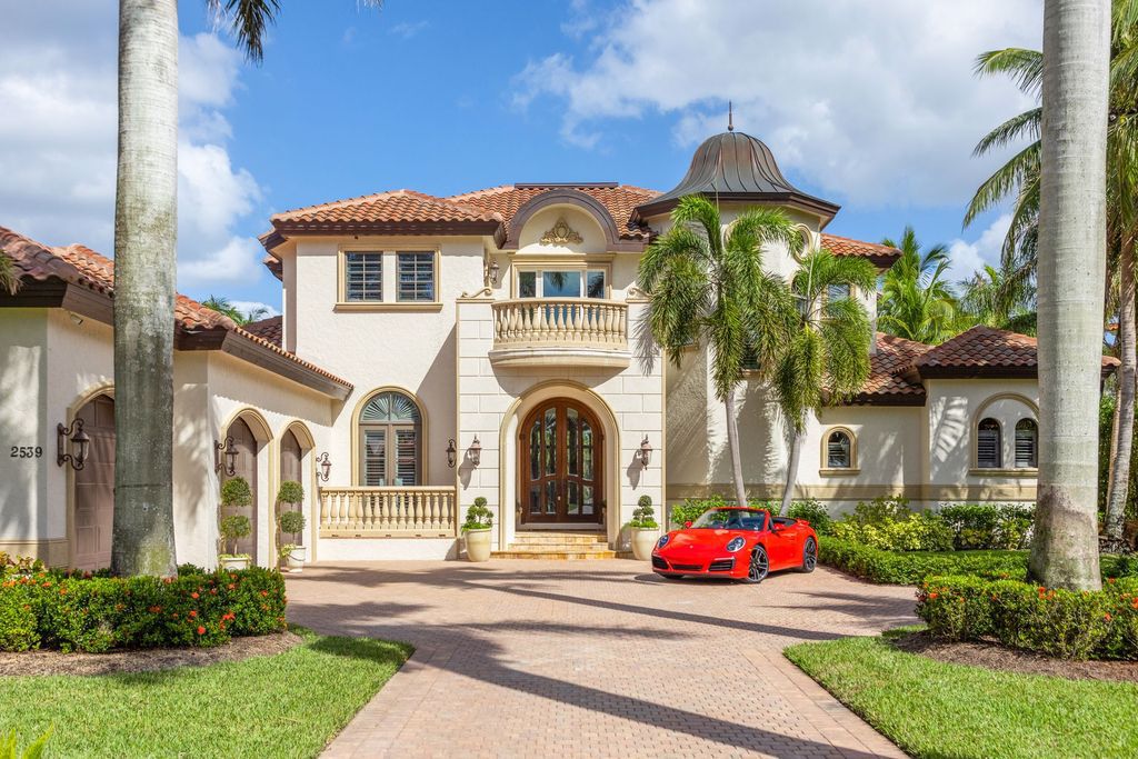2539 Escada Court, Naples, Florida is a custom-built estate just minutes to world class beaches, shopping and fine dining with picturesque pool and lake views from just about every room.