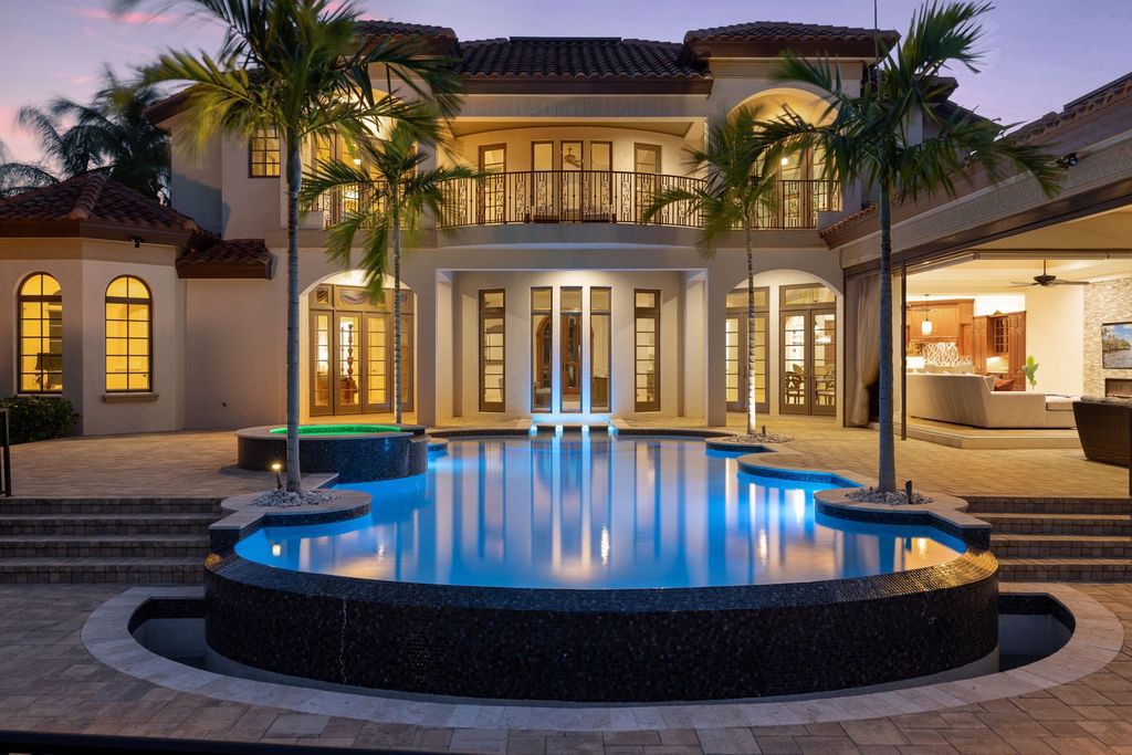 2539 Escada Court, Naples, Florida is a custom-built estate just minutes to world class beaches, shopping and fine dining with picturesque pool and lake views from just about every room.