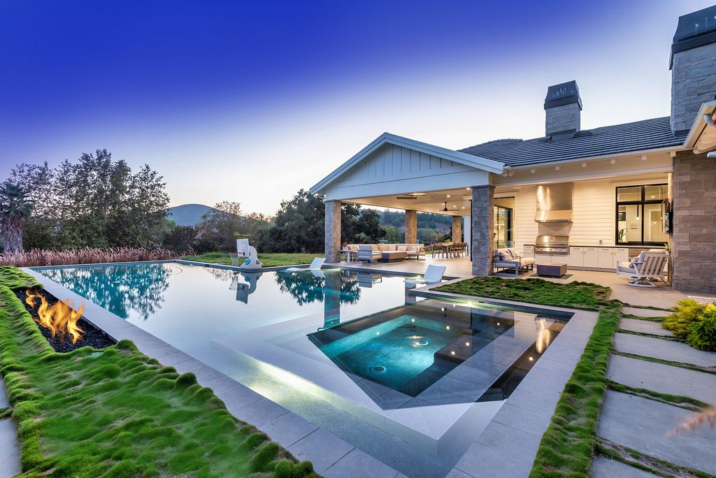 1781 Miller Ranch Drive, Thousand Oaks, California is an epic single story estate with resort quality grounds are simply perfect boasting a full sized basketball court, custom pool and spa.