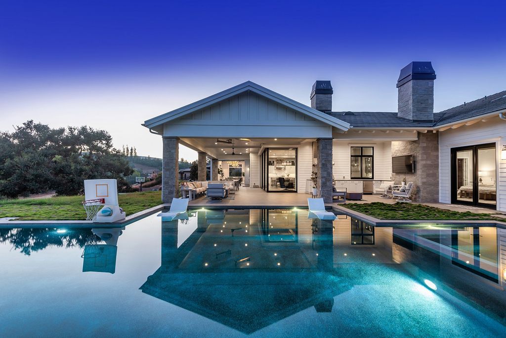 1781 Miller Ranch Drive, Thousand Oaks, California is an epic single story estate with resort quality grounds are simply perfect boasting a full sized basketball court, custom pool and spa.