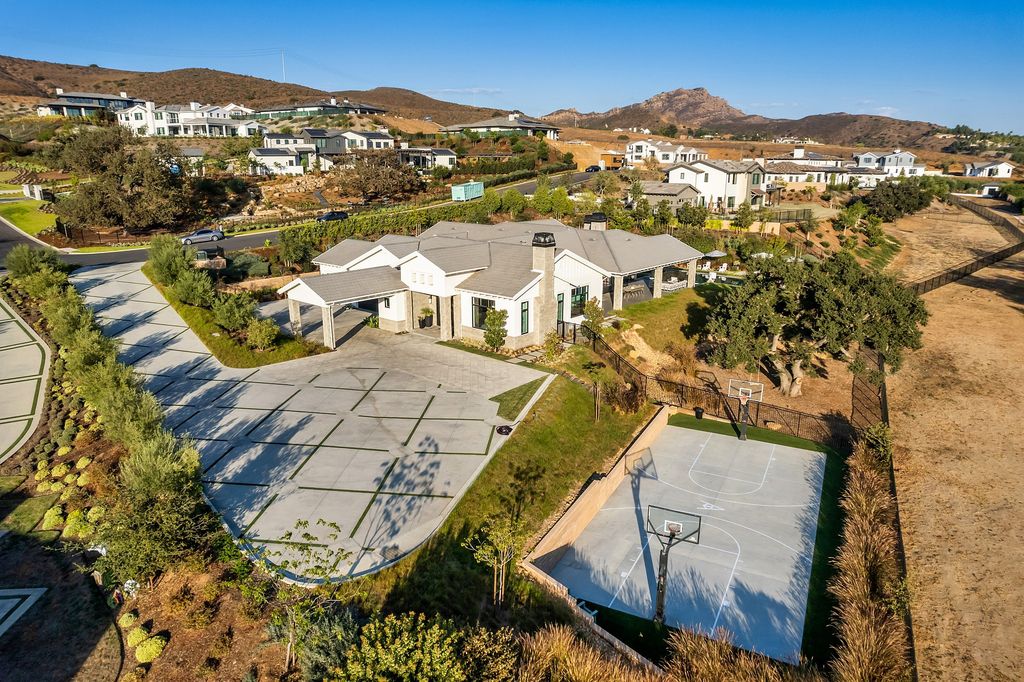 1781 Miller Ranch Drive, Thousand Oaks, California is an epic single story estate with resort quality grounds are simply perfect boasting a full sized basketball court, custom pool and spa.