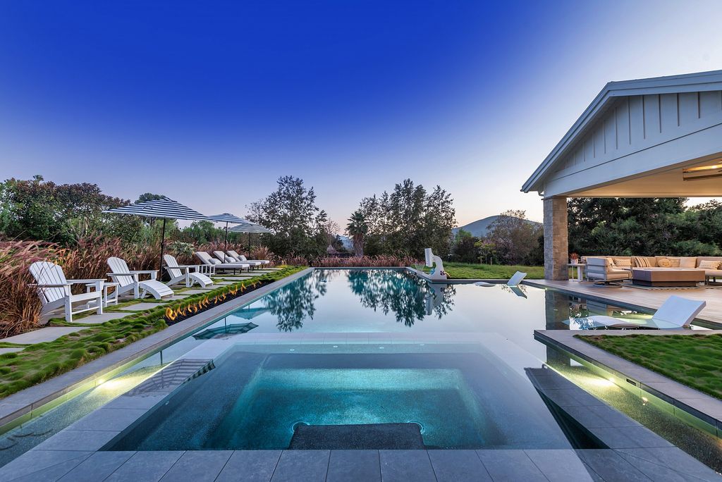 1781 Miller Ranch Drive, Thousand Oaks, California is an epic single story estate with resort quality grounds are simply perfect boasting a full sized basketball court, custom pool and spa.