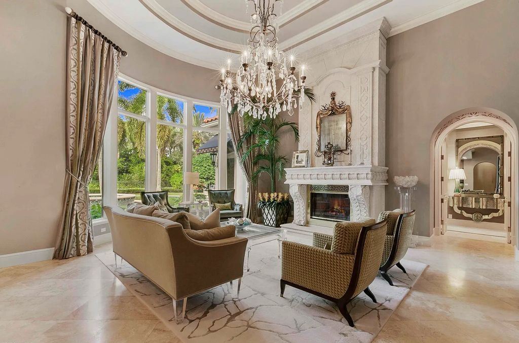 11701 San Sovino Court, Palm Beach Gardens, Florida is a private enclave on one of the most coveted streets within Old Palm Golf Club with tropical water feature view, expansive covered lanai, breezy awnings, heated pool & spa and more.