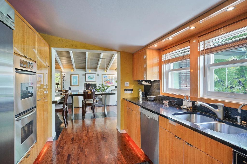 The House in Excelsior offers formal dining room along with unique built-in breakfast bar just off the kitchen, now available for sale. This home located at 2605 Maple Ridge Ln, Excelsior, Minnesota