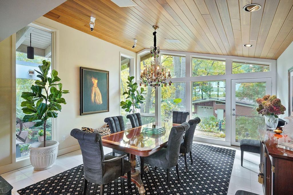 The House in Excelsior offers formal dining room along with unique built-in breakfast bar just off the kitchen, now available for sale. This home located at 2605 Maple Ridge Ln, Excelsior, Minnesota
