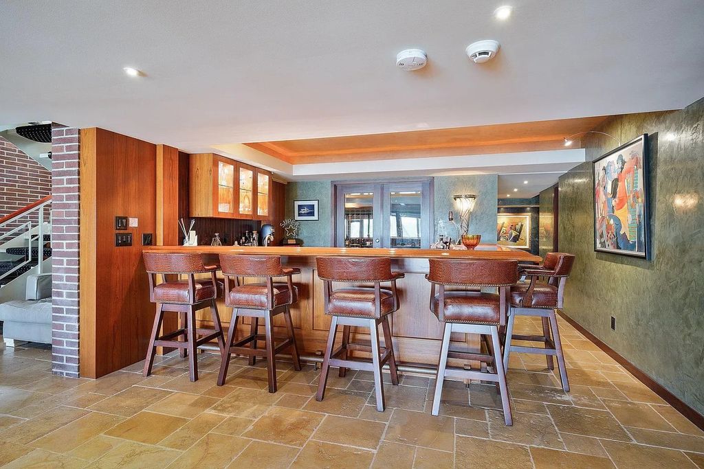 The House in Excelsior offers formal dining room along with unique built-in breakfast bar just off the kitchen, now available for sale. This home located at 2605 Maple Ridge Ln, Excelsior, Minnesota
