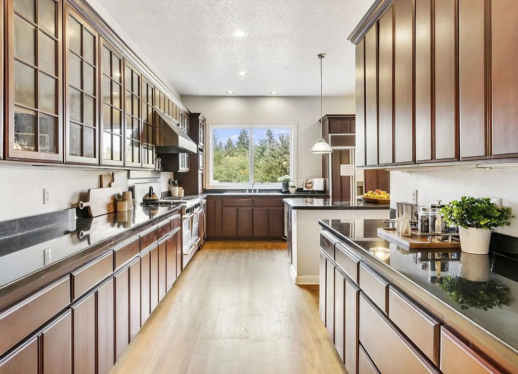 The Estate in Portland is a luxurious home commanding breathtaking panoramic views of 3 mountains now available for sale. This home located at 17010 NW Sheltered Nook Rd, Portland, Oregon; offering 06 bedrooms and 06 bathrooms with 7,719 square feet of living spaces.
