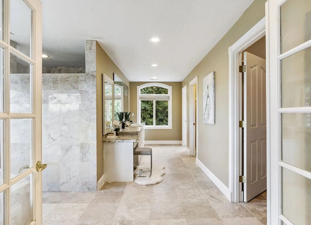 The Estate in Portland is a luxurious home commanding breathtaking panoramic views of 3 mountains now available for sale. This home located at 17010 NW Sheltered Nook Rd, Portland, Oregon; offering 06 bedrooms and 06 bathrooms with 7,719 square feet of living spaces.