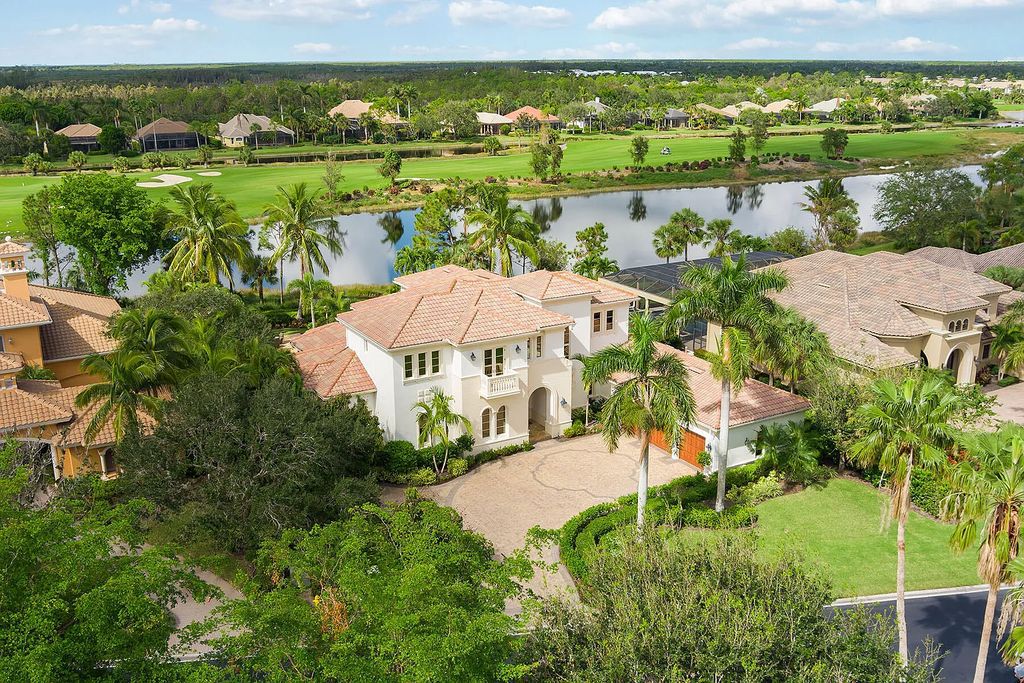3855 Isla Del Sol Way, Naples, Florida is an impressive in the award-winning community of Fiddler's Creek with a breathtaking view of the pool, lake, and golf course.
