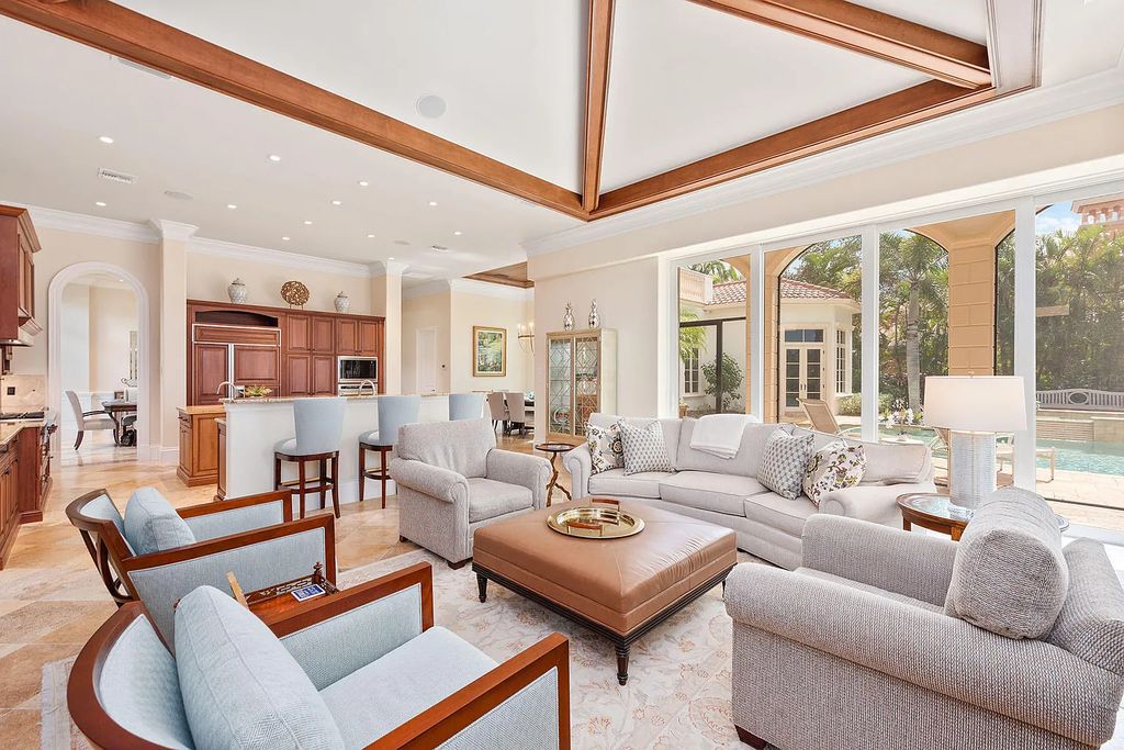 3855 Isla Del Sol Way, Naples, Florida is an impressive in the award-winning community of Fiddler's Creek with a breathtaking view of the pool, lake, and golf course.