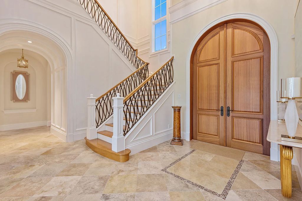 3855 Isla Del Sol Way, Naples, Florida is an impressive in the award-winning community of Fiddler's Creek with a breathtaking view of the pool, lake, and golf course.
