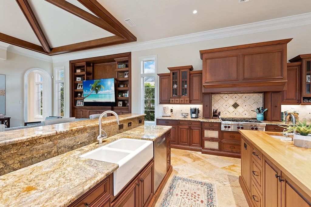 3855 Isla Del Sol Way, Naples, Florida is an impressive in the award-winning community of Fiddler's Creek with a breathtaking view of the pool, lake, and golf course.