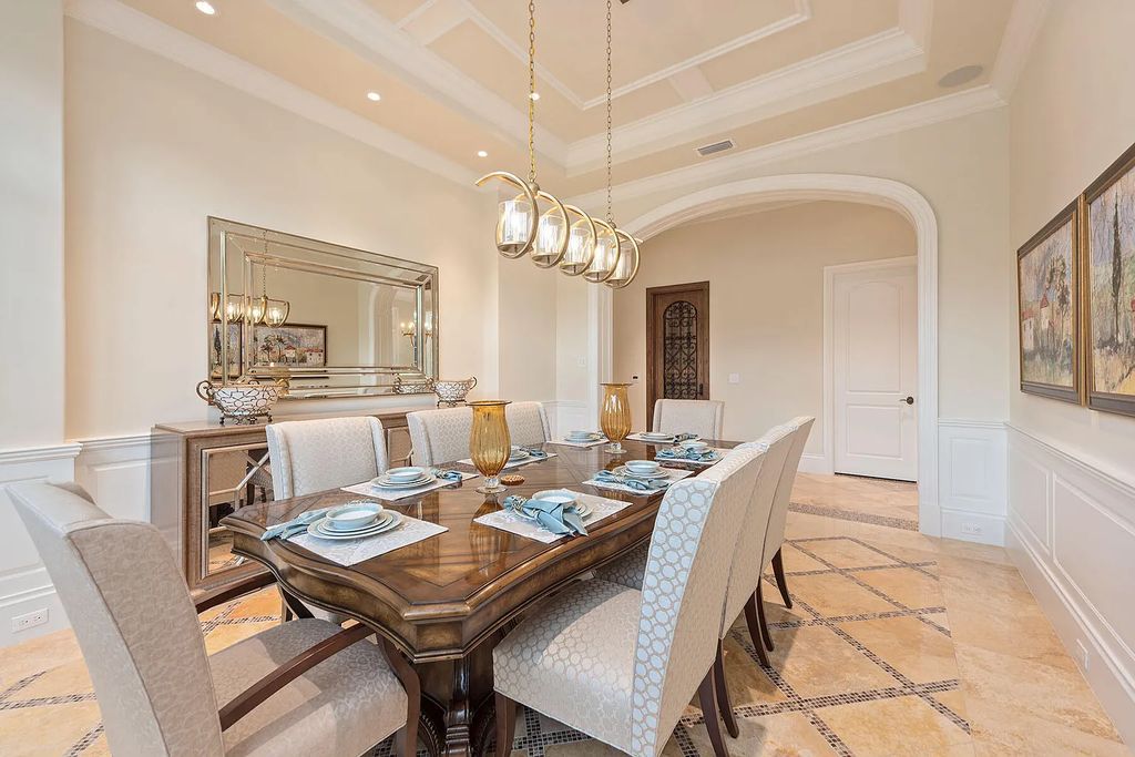 3855 Isla Del Sol Way, Naples, Florida is an impressive in the award-winning community of Fiddler's Creek with a breathtaking view of the pool, lake, and golf course.