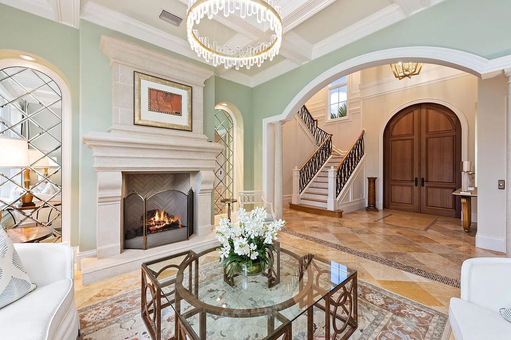 3855 Isla Del Sol Way, Naples, Florida is an impressive in the award-winning community of Fiddler's Creek with a breathtaking view of the pool, lake, and golf course.