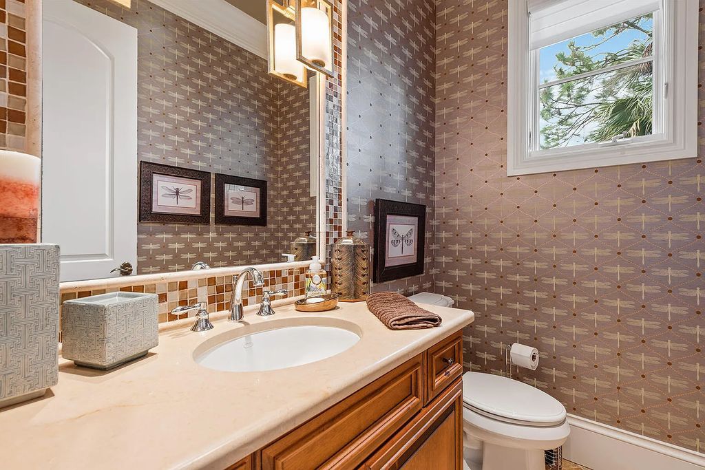 3855 Isla Del Sol Way, Naples, Florida is an impressive in the award-winning community of Fiddler's Creek with a breathtaking view of the pool, lake, and golf course.