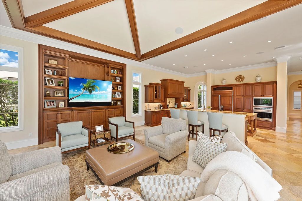 3855 Isla Del Sol Way, Naples, Florida is an impressive in the award-winning community of Fiddler's Creek with a breathtaking view of the pool, lake, and golf course.