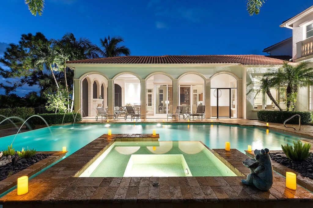 3855 Isla Del Sol Way, Naples, Florida is an impressive in the award-winning community of Fiddler's Creek with a breathtaking view of the pool, lake, and golf course.