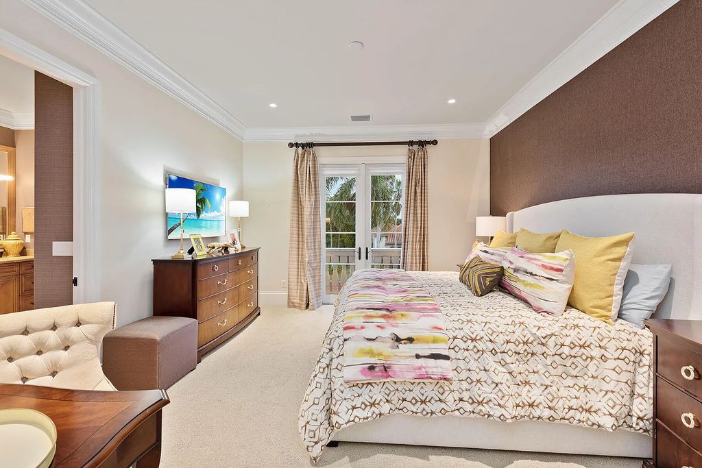 3855 Isla Del Sol Way, Naples, Florida is an impressive in the award-winning community of Fiddler's Creek with a breathtaking view of the pool, lake, and golf course.