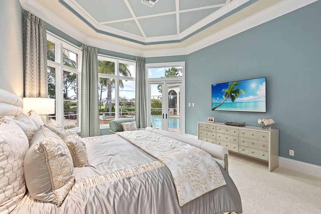 3855 Isla Del Sol Way, Naples, Florida is an impressive in the award-winning community of Fiddler's Creek with a breathtaking view of the pool, lake, and golf course.