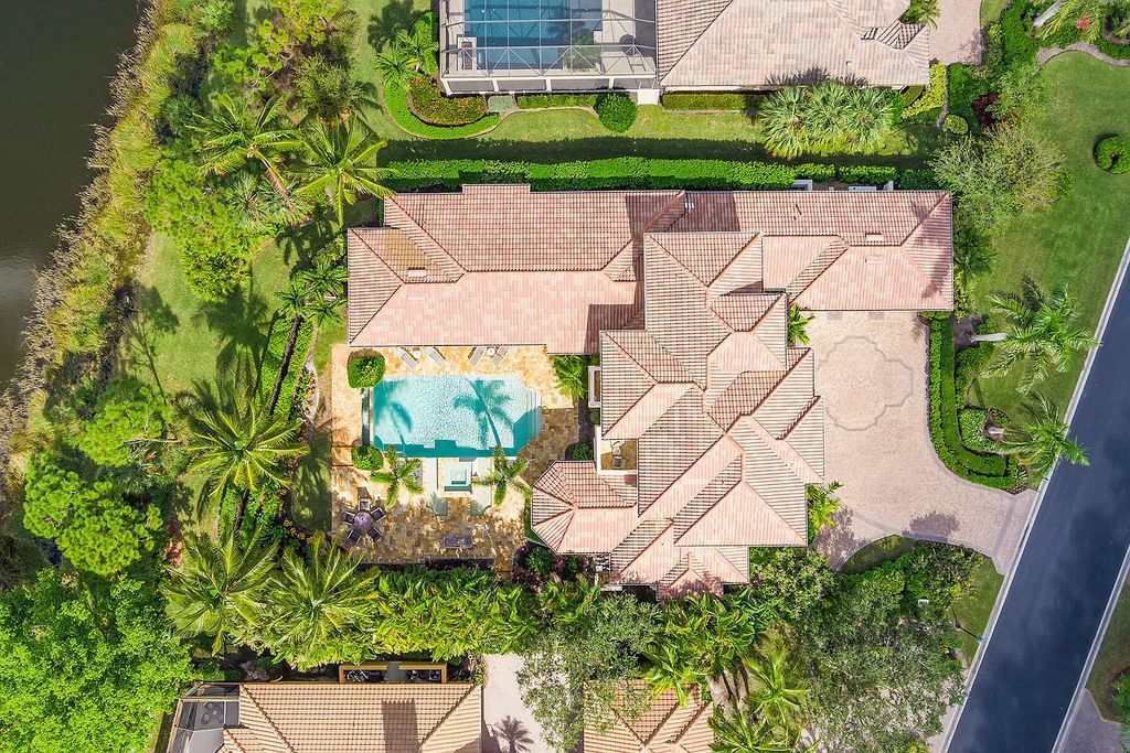3855 Isla Del Sol Way, Naples, Florida is an impressive in the award-winning community of Fiddler's Creek with a breathtaking view of the pool, lake, and golf course.