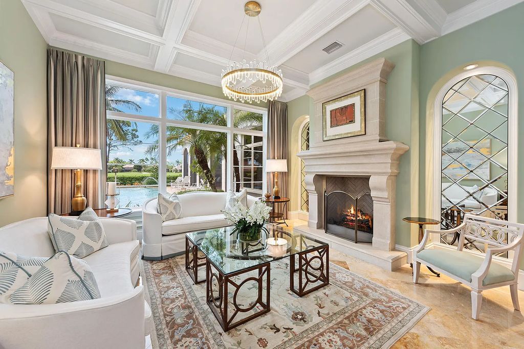 3855 Isla Del Sol Way, Naples, Florida is an impressive in the award-winning community of Fiddler's Creek with a breathtaking view of the pool, lake, and golf course.
