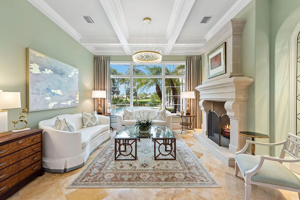 3855 Isla Del Sol Way, Naples, Florida is an impressive in the award-winning community of Fiddler's Creek with a breathtaking view of the pool, lake, and golf course.