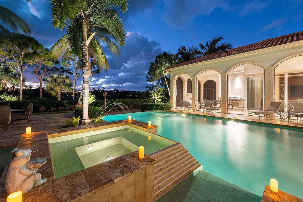3855 Isla Del Sol Way, Naples, Florida is an impressive in the award-winning community of Fiddler's Creek with a breathtaking view of the pool, lake, and golf course.