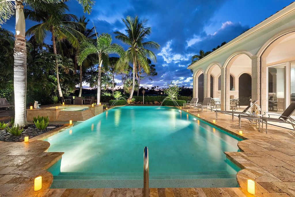 3855 Isla Del Sol Way, Naples, Florida is an impressive in the award-winning community of Fiddler's Creek with a breathtaking view of the pool, lake, and golf course.