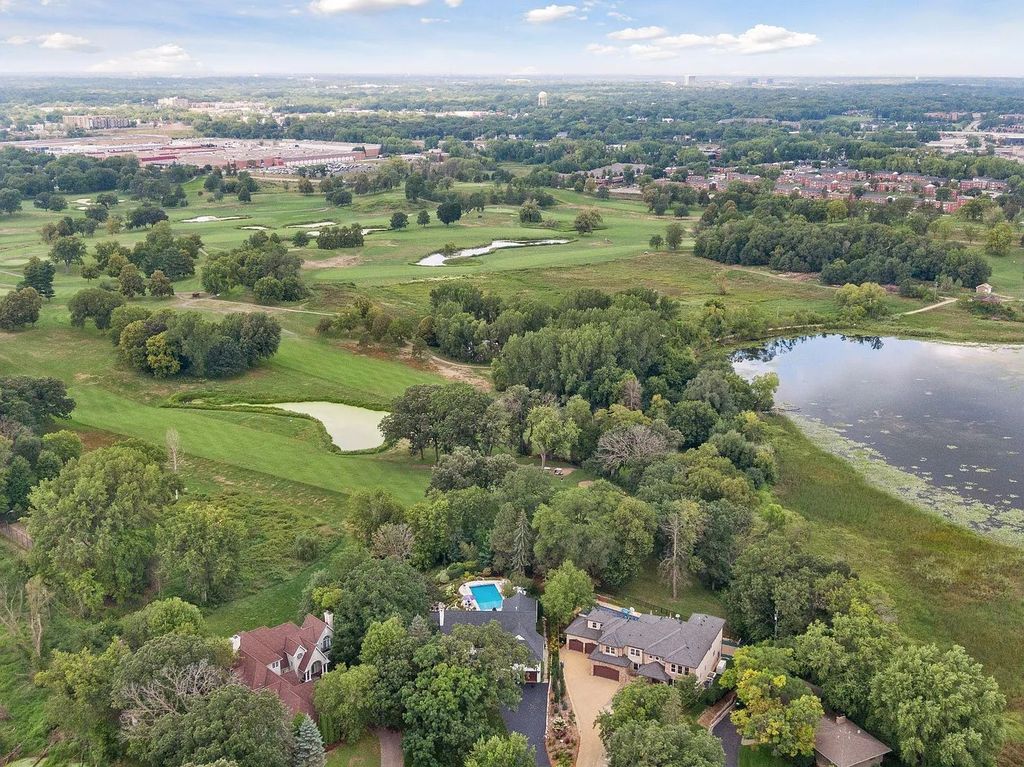 The Property in Edina is Thoughtfully nicknamed “Little Tuscany” the combination of luscious landscaping, golf course views and entertainment area, now available for sale. This home located at 27 Circle W, Edina, Minnesota