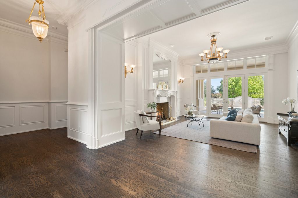 208 Bella Riva Drive, Austin, Texas seated on a well-manicured acre lot with complete privacy and lake views in the coveted gated community of Costa Bella on Lake Travis boasting timeless, high-quality craftsmanship abounds in every corner.