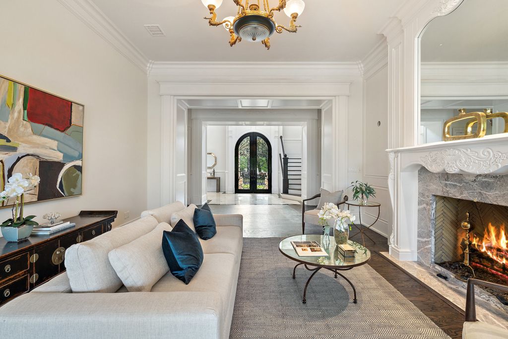 208 Bella Riva Drive, Austin, Texas seated on a well-manicured acre lot with complete privacy and lake views in the coveted gated community of Costa Bella on Lake Travis boasting timeless, high-quality craftsmanship abounds in every corner.