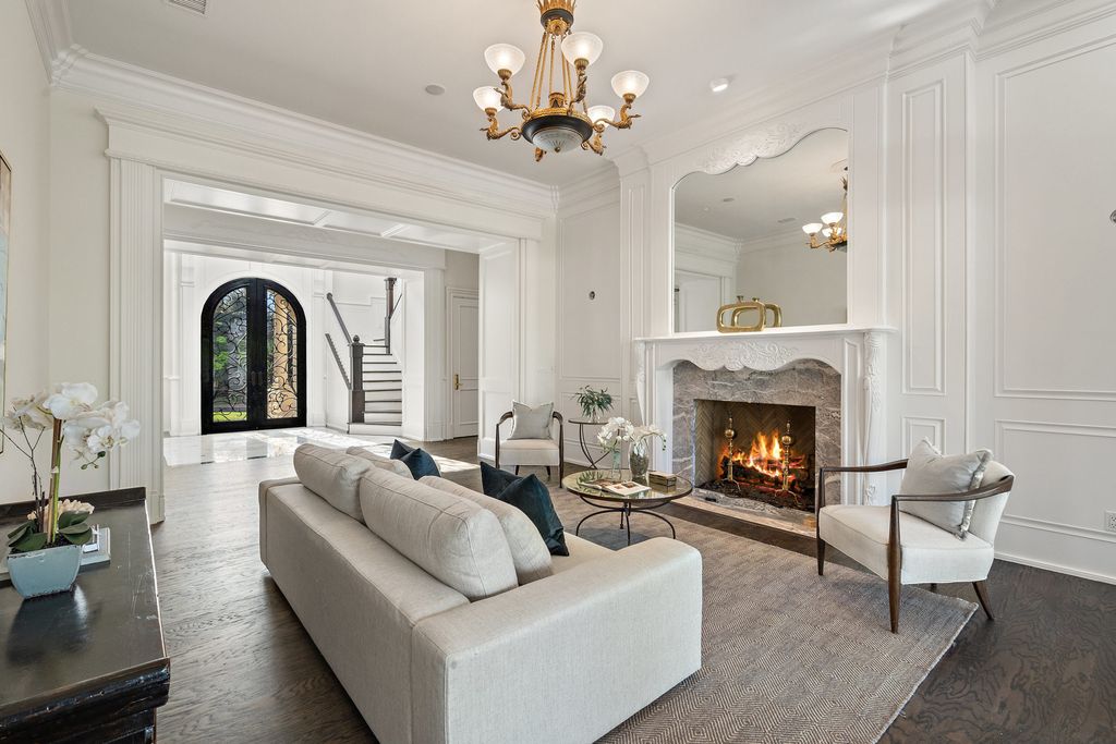 208 Bella Riva Drive, Austin, Texas seated on a well-manicured acre lot with complete privacy and lake views in the coveted gated community of Costa Bella on Lake Travis boasting timeless, high-quality craftsmanship abounds in every corner.