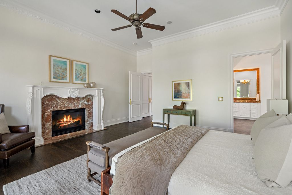 208 Bella Riva Drive, Austin, Texas seated on a well-manicured acre lot with complete privacy and lake views in the coveted gated community of Costa Bella on Lake Travis boasting timeless, high-quality craftsmanship abounds in every corner.