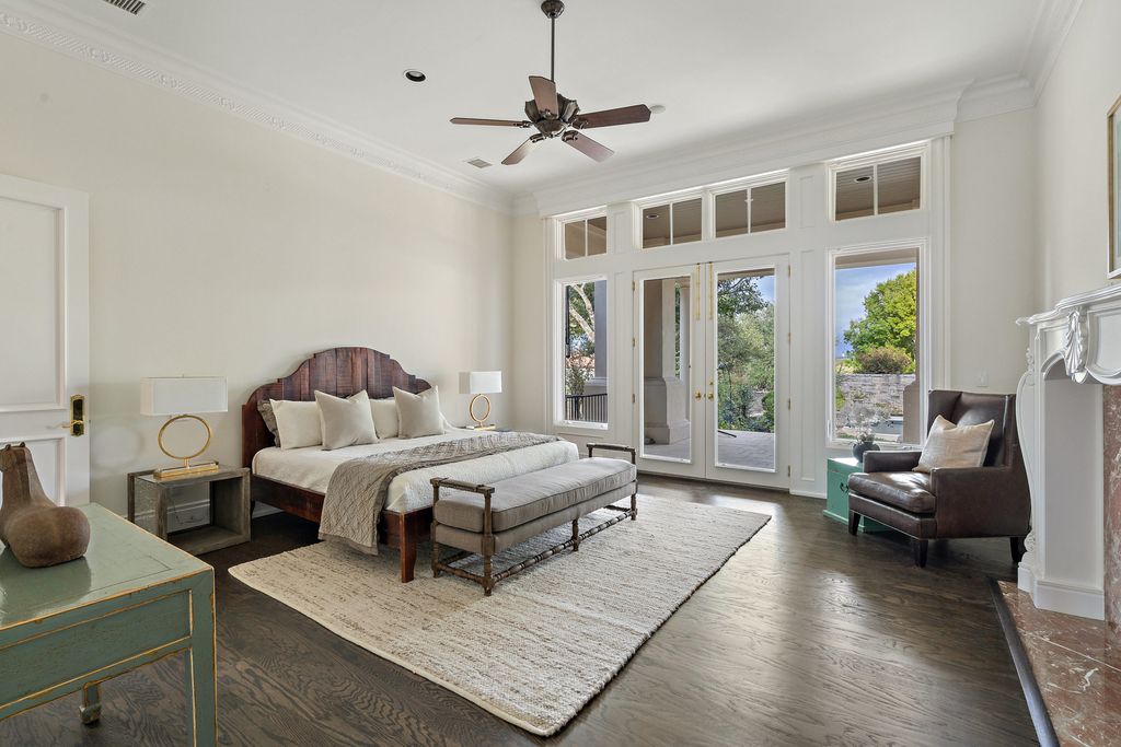208 Bella Riva Drive, Austin, Texas seated on a well-manicured acre lot with complete privacy and lake views in the coveted gated community of Costa Bella on Lake Travis boasting timeless, high-quality craftsmanship abounds in every corner.