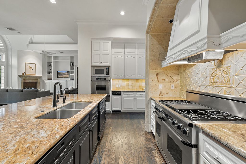 208 Bella Riva Drive, Austin, Texas seated on a well-manicured acre lot with complete privacy and lake views in the coveted gated community of Costa Bella on Lake Travis boasting timeless, high-quality craftsmanship abounds in every corner.