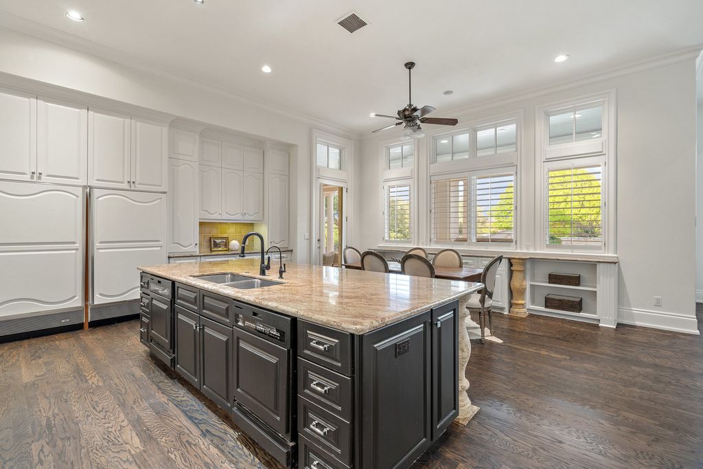 208 Bella Riva Drive, Austin, Texas seated on a well-manicured acre lot with complete privacy and lake views in the coveted gated community of Costa Bella on Lake Travis boasting timeless, high-quality craftsmanship abounds in every corner.