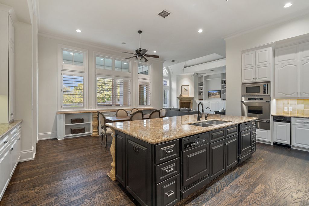 208 Bella Riva Drive, Austin, Texas seated on a well-manicured acre lot with complete privacy and lake views in the coveted gated community of Costa Bella on Lake Travis boasting timeless, high-quality craftsmanship abounds in every corner.